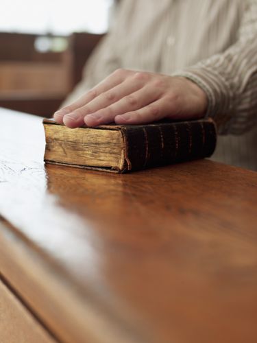 hand on bible in court