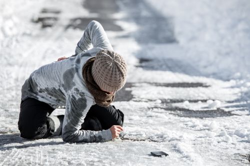 Woman slips and falls on ice