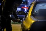 Car Thief Using a Screwdriver to Brake into a Car