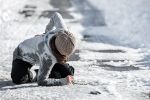 Woman slips and falls on ice