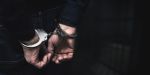 person in handcuffs